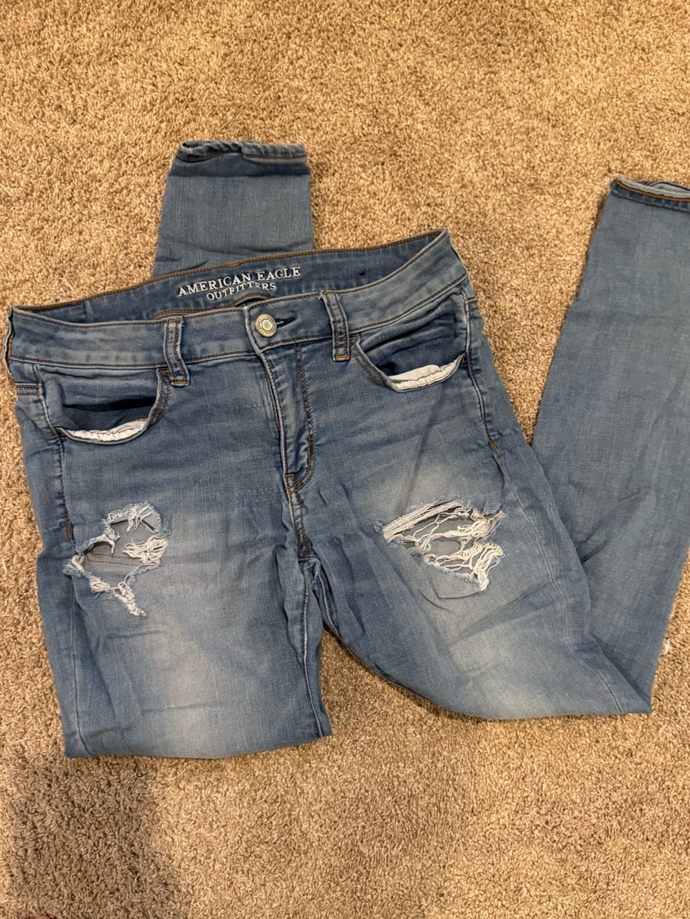American Eagle Outfitters Light Wash Skinny Jeans with Distressed Knees
